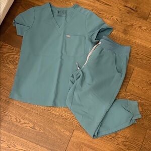 Figs scrubs— small top, petite medium bottoms.